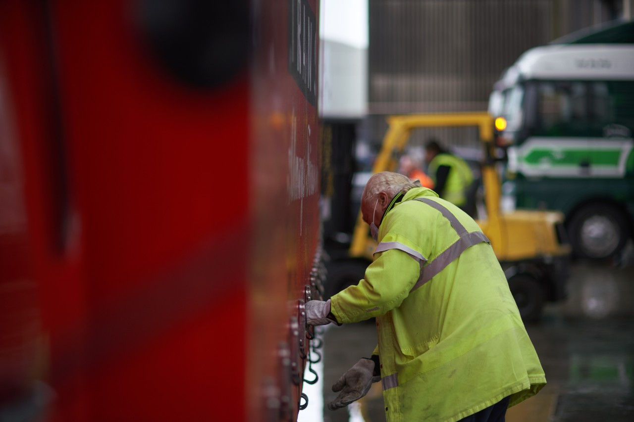 Worker securing a truck